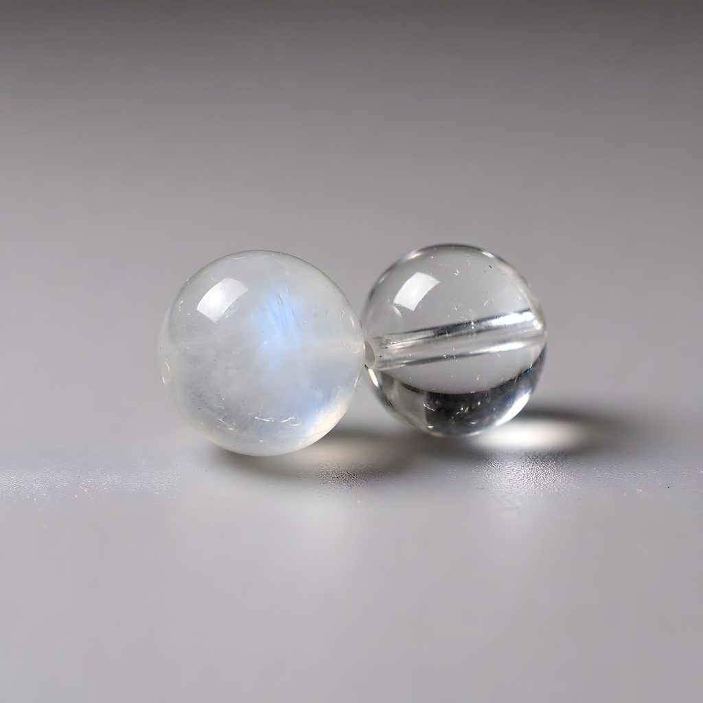 Blue moonstone and clear quartz bead close-up