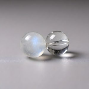 Blue moonstone and clear quartz bead close-up