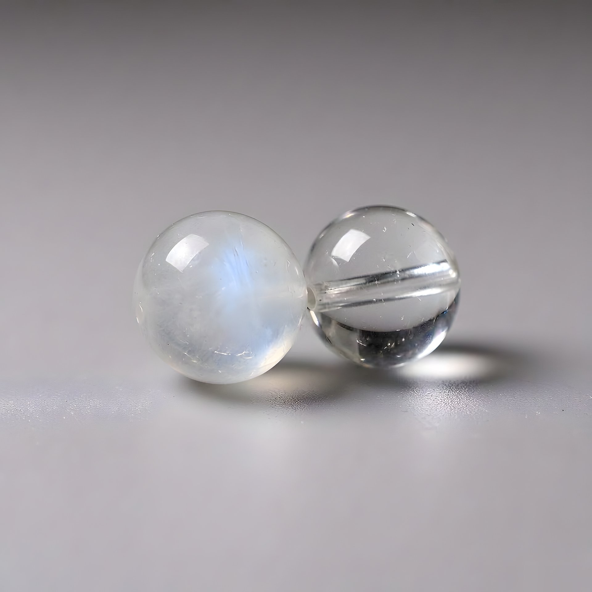 Blue moonstone and clear quartz bead close-up