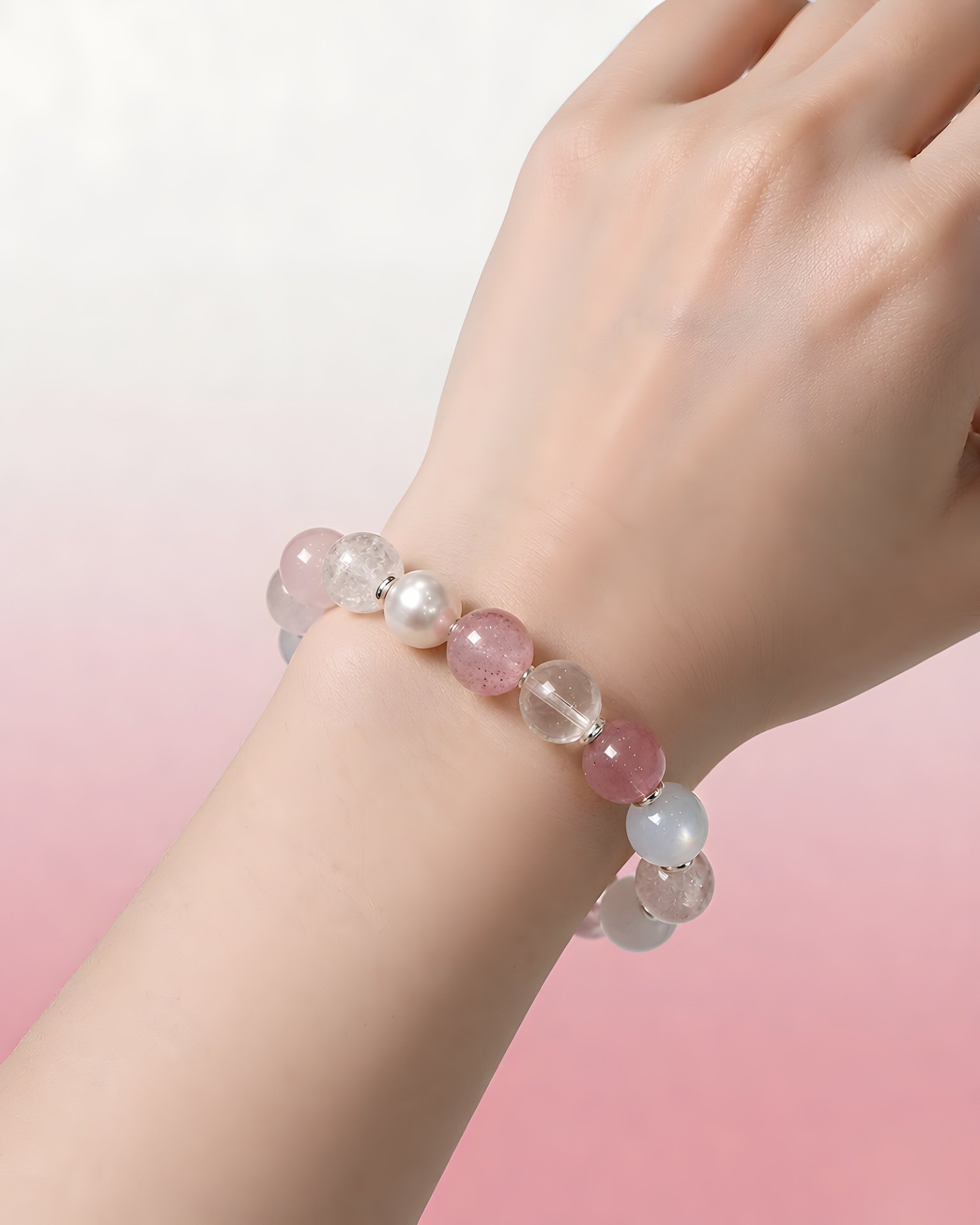 VenusGlow natural gemstone bracelet with pearls worn on a wrist against a soft pink background